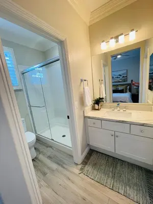 a bathroom with a shower and a sink and a toilet at Newly Built Coastal Southern California Getaway in Carlsbad