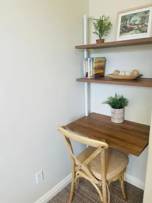 a wooden desk with a chair in a room at Newly Built Coastal Southern California Getaway in Carlsbad