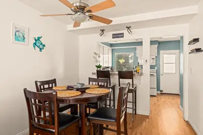 a dining room and kitchen with a table and chairs at Bayfront Bliss in San Diego