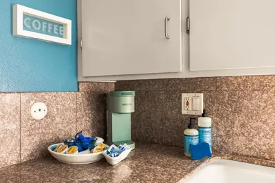 a kitchen counter with a sink and a coffee maker at Bayfront Bliss in San Diego