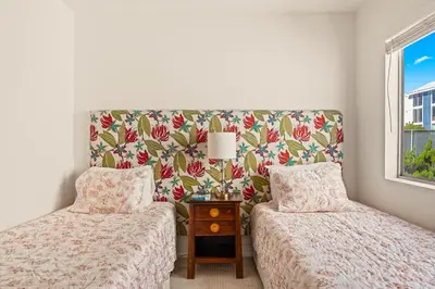 a bedroom with two beds and a window at Bayfront Bliss in San Diego