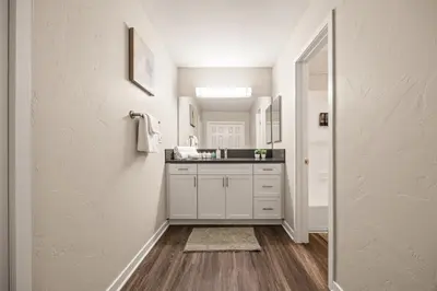 a bathroom with white cabinets and a sink at Luxury 2BR Apartment Near SeaWorld, Airport & Downtown San Diego in San Diego