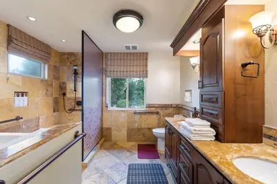 a bathroom with a sink and a toilet and a shower at Tuscan Views with Country Vibes in Bonsall