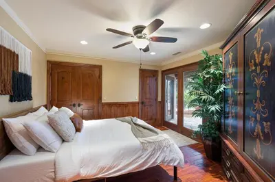 a bedroom with a bed and a ceiling fan at Tuscan Views with Country Vibes in Bonsall