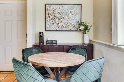 a dining room with a wooden table and chairs at Hike, Sip and Explore Couples Retreat in Fallbrook in Fallbrook