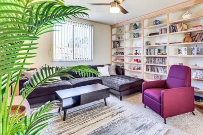 a living room with a couch and a purple chair at Hike, Sip and Explore Couples Retreat in Fallbrook in Fallbrook