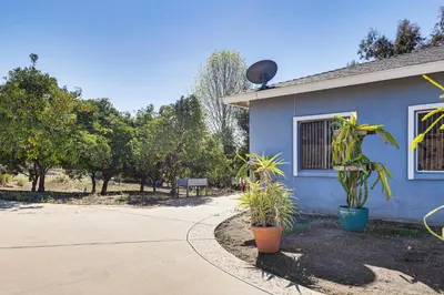a blue house with plants in front of it at Hike, Sip and Explore Couples Retreat in Fallbrook in Fallbrook