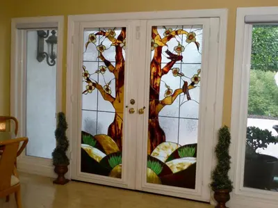 a glass door with a tree mural on it at Bella Vita Gated Resort in Escondido