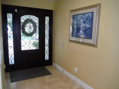a hallway with a door with a wreath on it at Bella Vita Gated Resort in Escondido