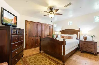 a bedroom with a bed and a ceiling fan at Fallbrook Vineyard Estate in Fallbrook