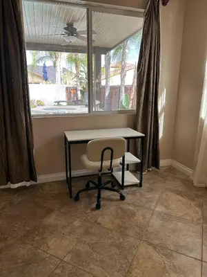 a desk and a chair in a room with a window at Oasis in Southern California for 8 guests in Winchester