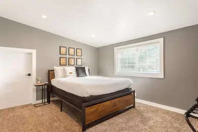 a bedroom with a bed and a window at Man Cave and She Shed in Fallbrook