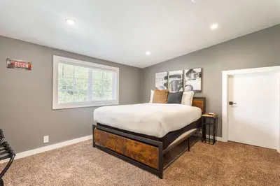 a bedroom with a large bed and a window at Man Cave and She Shed in Fallbrook