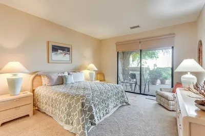 a bedroom with a bed and a sliding glass door at Pool and Tennis Court Access Borrego Springs Condo in Borrego Springs