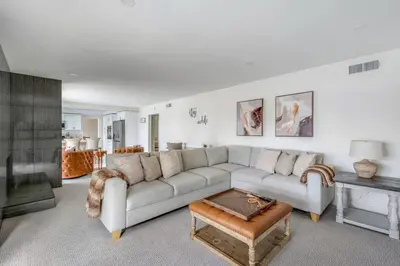 a living room with a couch and a table at VaCaTiOn Pool FirePit PoolTable CloseToFwy in Mission Viejo