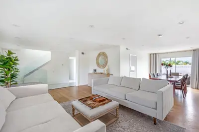 a living room with white furniture and a table at VaCaTiOn Pool FirePit PoolTable CloseToFwy in Mission Viejo