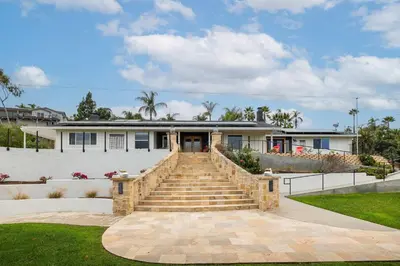 a house with a staircase in front of it at Luxury Oasis Valley Views Gameroom Villa in Vista