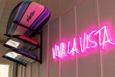 a neon sign that says wiiulia on a wall at Luxury Oasis Valley Views Gameroom Villa in Vista