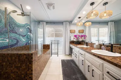 a bathroom with two sinks and a shower at Luxury Oasis Valley Views Gameroom Villa in Vista