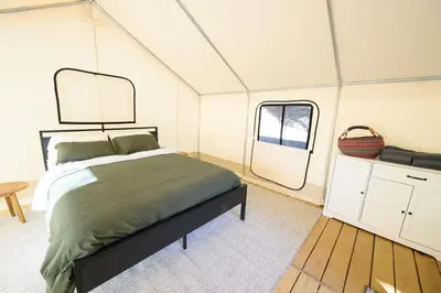 a bedroom with a bed in a tent at Boutique Nature Retreat in the Palomar Mountains in Pauma Valley