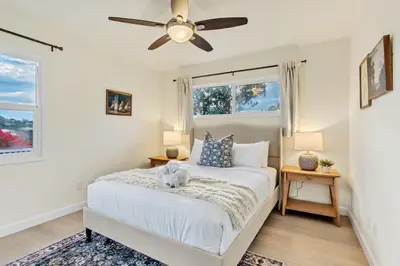 a bedroom with a bed and a ceiling fan at Newly Furnished 3BR 1BA - Spa - AC - Large Backyard in San Diego