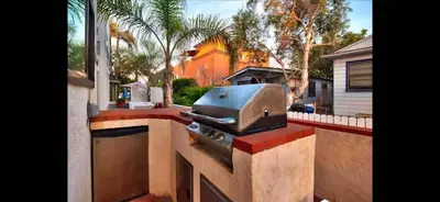 a outdoor kitchen with a grill on a counter at Mission Beach Suite Parking Steps 2 Ocean in San Diego