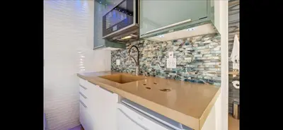 a kitchen with a sink and a counter top at Mission Beach Suite Parking Steps 2 Ocean in San Diego