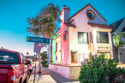 a street sign in front of a house at Entire Mission Beach Duplex Steps 2 the Ocean & Bay 2 Parking Spots in San Diego