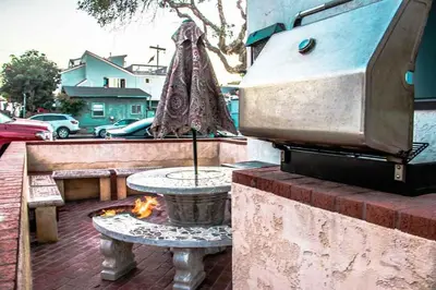 a patio with a table and a fire pit at Entire Mission Beach Duplex Steps 2 the Ocean & Bay 2 Parking Spots in San Diego