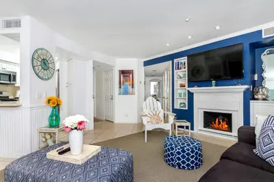 a living room with a couch and a fireplace at 5N-31 Beach View BBQ & Jacuzzi in Oceanside