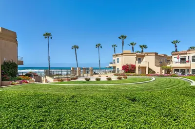 a park with palm trees and the ocean in the background at 5N-53 Beach Bliss Ocean Views in Oceanside