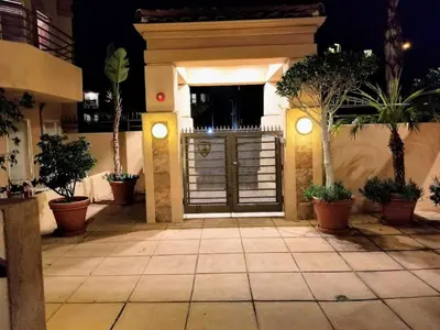 a front door of a house with potted plants at 501P-5 Panoramic Ocean & Pier Views in Oceanside