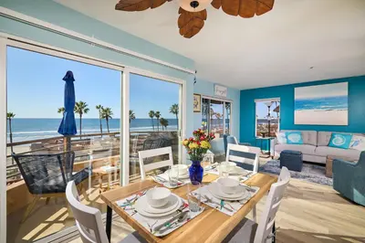 a dining room with a view of the ocean at 501P-12 Spectacular Ocean Views Pet Friendly in Oceanside