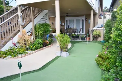 a house with a green yard with plants at Suite with Rooftop Deck and Ocean Views in Mission Bay in San Diego