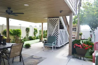 a covered patio with a table and chairs and a ceiling at Suite with Rooftop Deck and Ocean Views in Mission Bay in San Diego