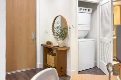 a mirror sitting on a table in a kitchen at Luxury 1BR Newport Beach Condo with Pool and Gym in Newport Beach