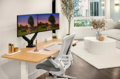 a desk with a computer on it in a living room at Luxury 1BR Newport Beach Condo with Pool and Gym in Newport Beach
