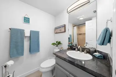 a bathroom with a sink and a toilet at Family Ocean Front 3BR with Parking in San Diego
