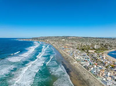 an aerial view of a beach and the ocean at Family Ocean Front 3BR with Parking in San Diego