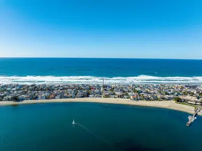 an aerial view of a beach next to the ocean at Family Ocean Front 3BR with Parking in San Diego
