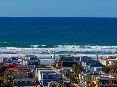 a view of a beach with houses and the ocean at Family Ocean Front 3BR with Parking in San Diego