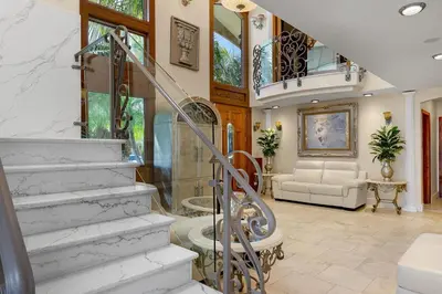 a home with a staircase and a living room at Family Luxurious Waterfront Escape in San Diego