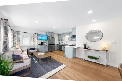a living room with a couch and a table at Suite Cozy Beach Nook 150 Steps To The Sand in San Diego