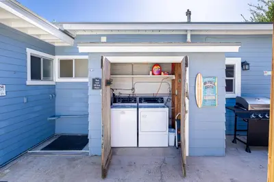 a blue house with a refrigerator and a stove in a garage at Suite Cozy Beach Nook 150 Steps To The Sand in San Diego