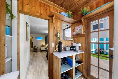an interior view of a tiny house with wooden walls at The Sweet Escape for 2 in San Diego