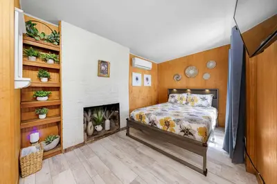 a bedroom with a bed and a fireplace at The Sweet Escape for 2 in San Diego