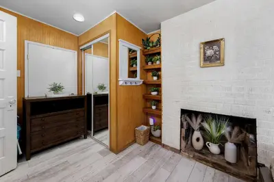a living room with a fireplace and a mirror at The Sweet Escape for 2 in San Diego