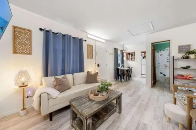 a living room with a couch and a table at The Sweet Escape for 2 in San Diego