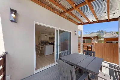 a patio with a table and chairs on a deck at Stylish Studio with Big Patio in San Diego