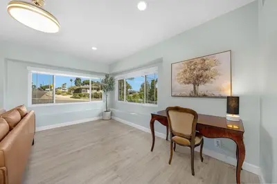 a living room with a desk and a couch at Family Hilltop luxe retreat with breathtaking views in La Mesa